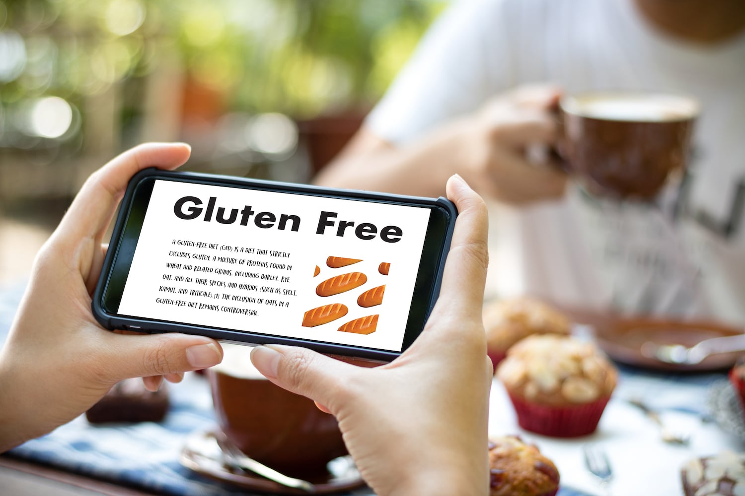 Woman looking at gluten-free recipes on phone