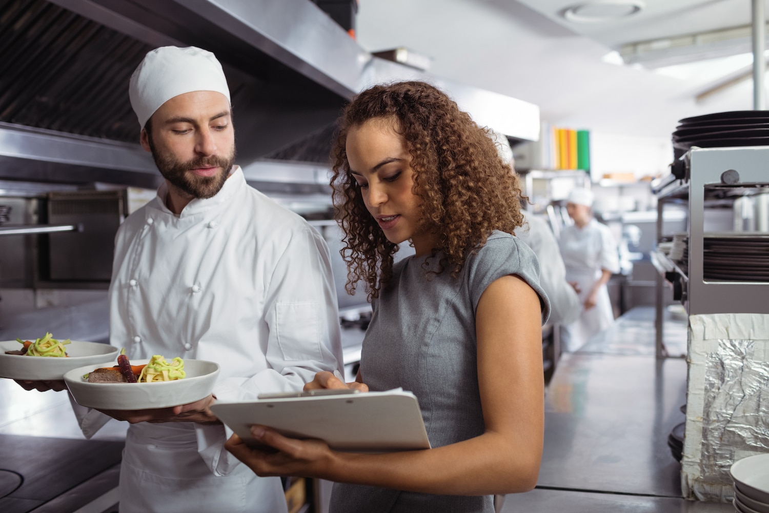 Facility manager talking with the chef