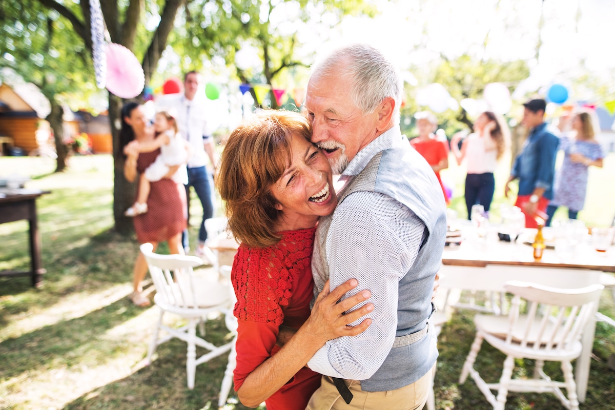 Older couple dancing at outdoor party