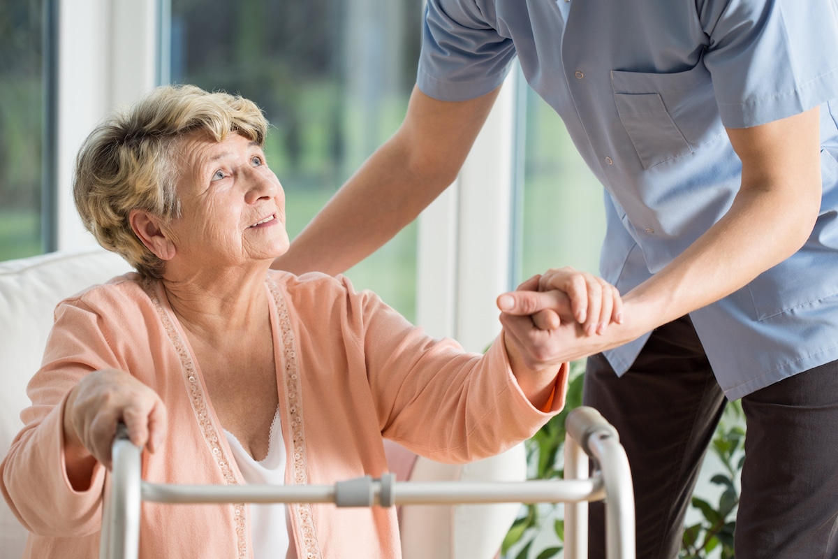 Elderly woman using her walker