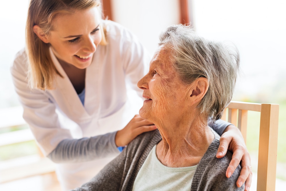 Health professional with elderly woman