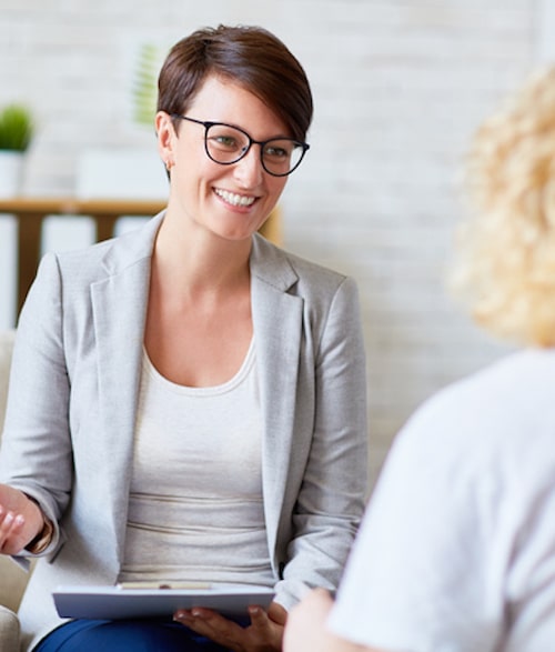 Successful psychologist talking to her patient