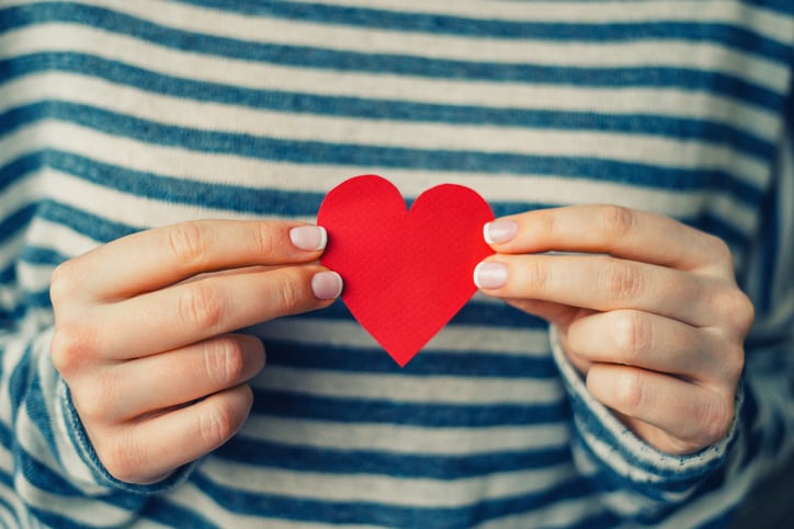 Woman holding heart